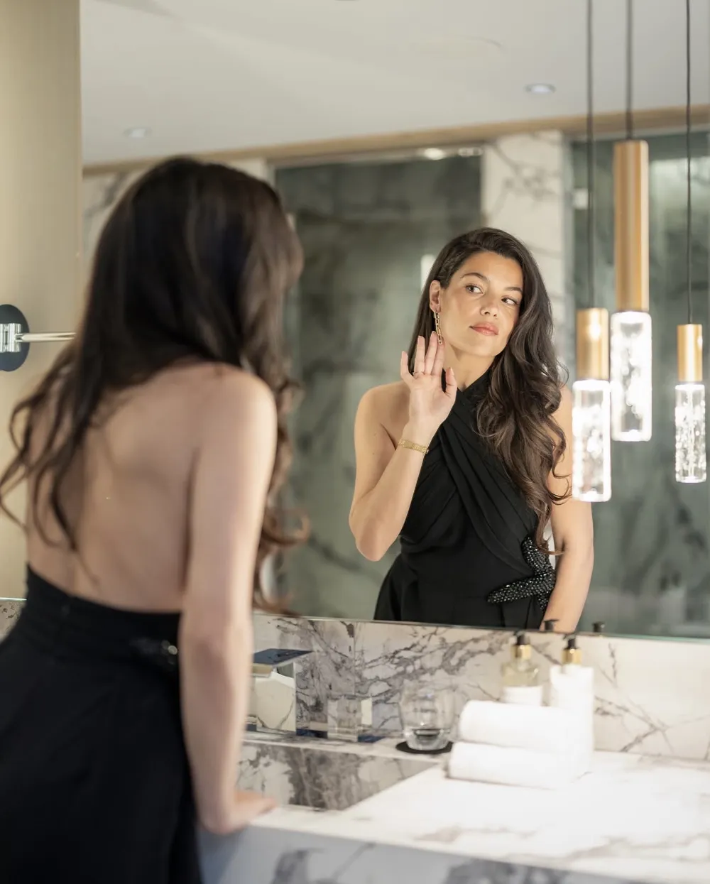 Make-up and hair at the K2 Palace in Courchevel, woman looking in the mirror