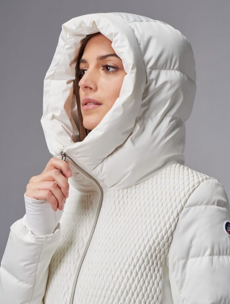 Fashion portrait in a white hooded puffer jacket